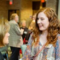 Student speaking to a donor at Scholarship Dinner 2019
